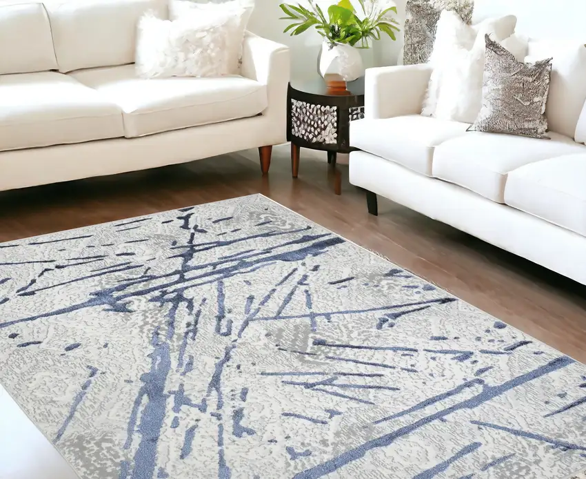 Ivory and Blue Abstract Area Rug Photo 1