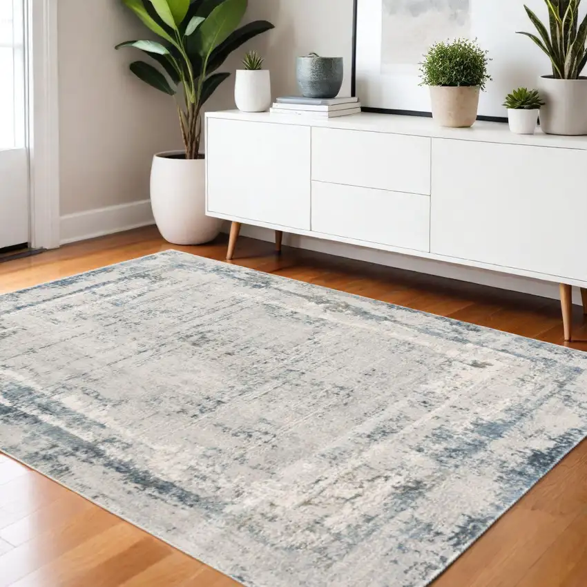 Blue and Ivory Abstract Power Loom Area Rug Photo 1