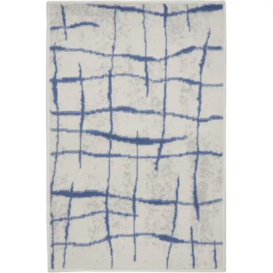 Ivory and Blue Abstract Distressed Area Rug Photo 1