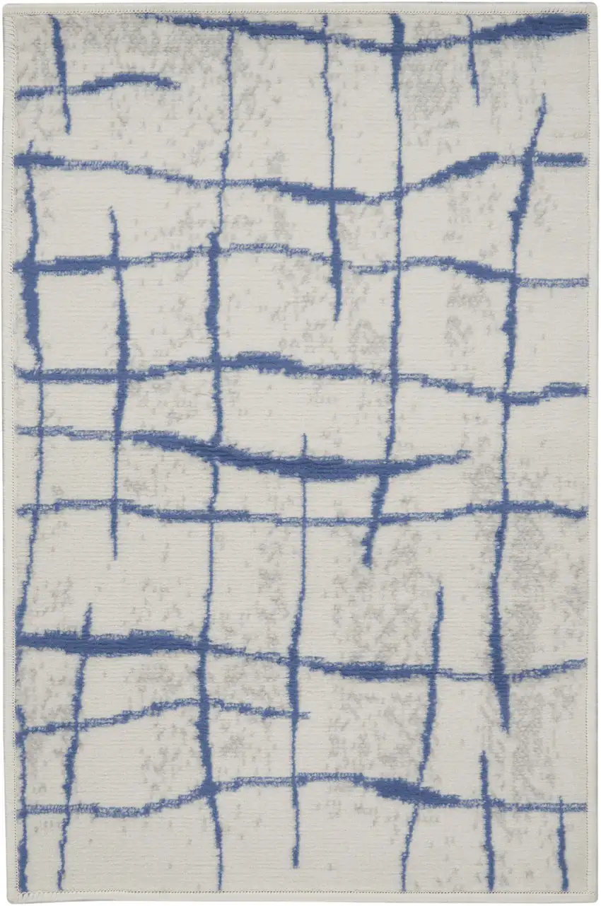 Ivory and Blue Abstract Distressed Area Rug Photo 1