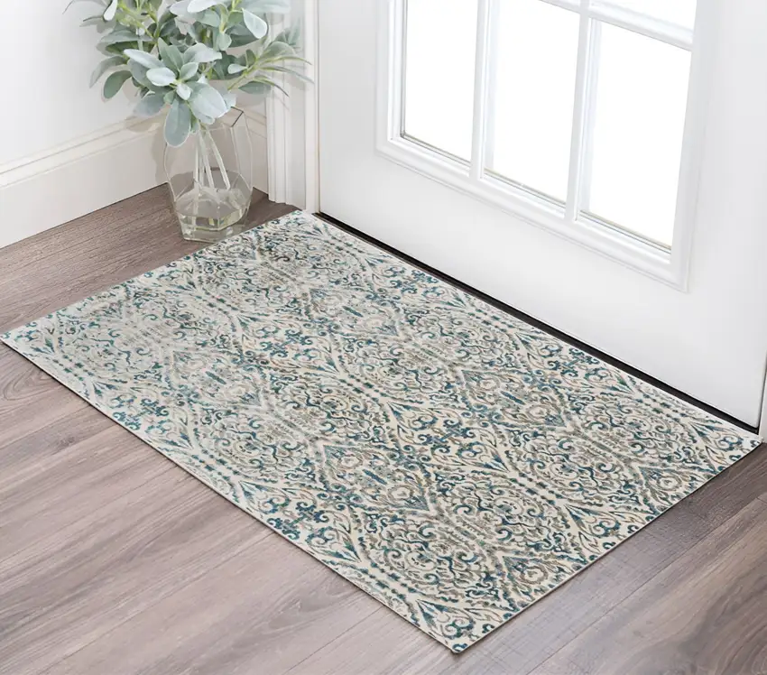 Ivory and Blue Abstract Power Loom Area Rug Photo 1
