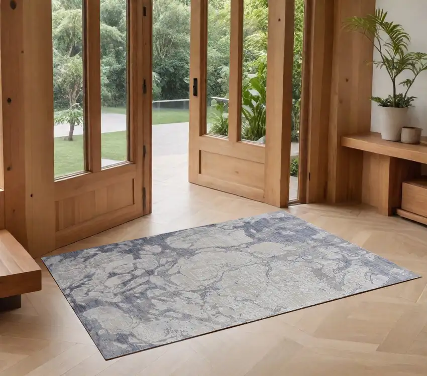 Ivory and Blue Abstract Power Loom Worn Faded Area Rug Photo 1