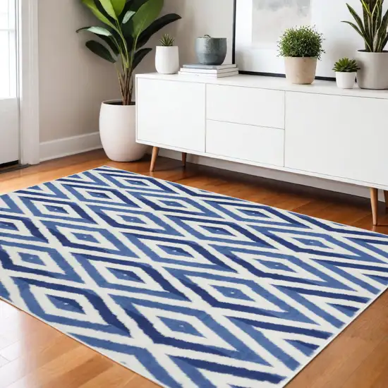Ivory And Blue Geometric Area Rug Photo 2
