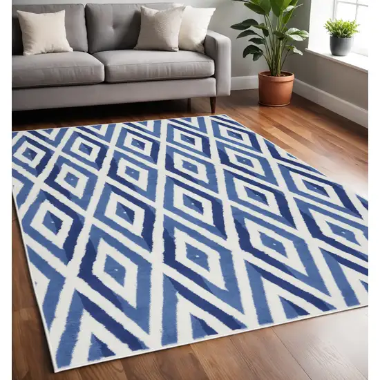 Ivory And Blue Geometric Area Rug Photo 2