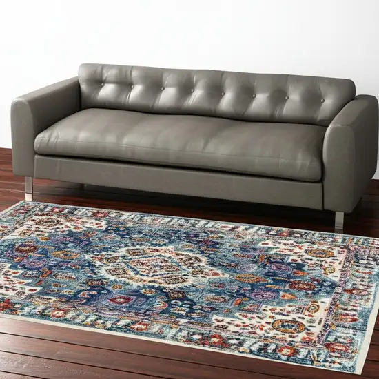 Ivory And Blue Floral Distressed Area Rug Photo 1