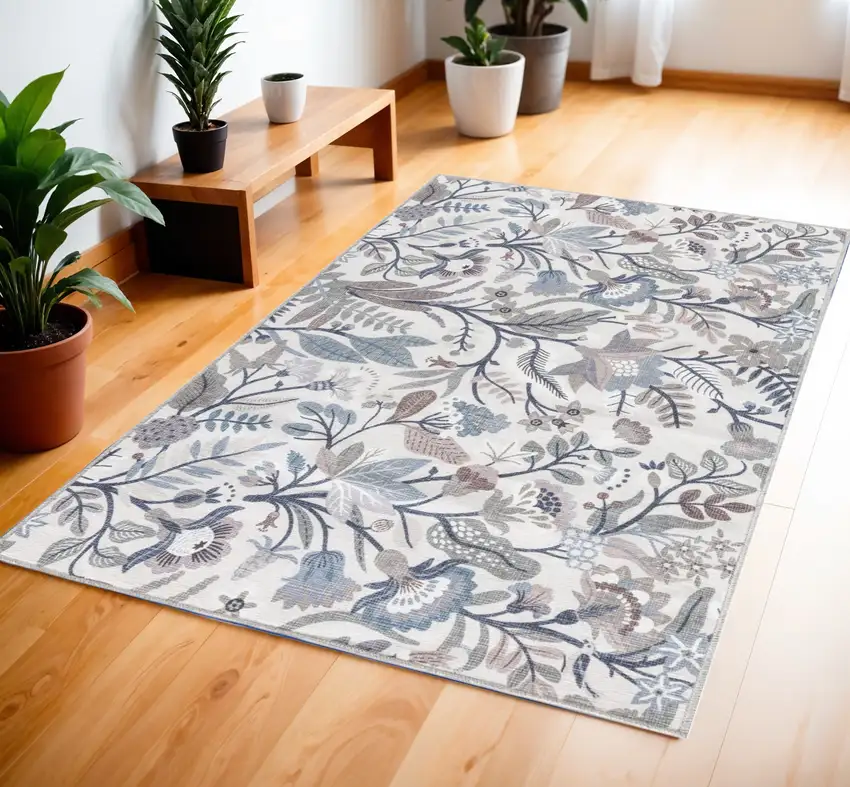 Ivory and Blue Floral Power Loom Washable Non Skid Area Rug Photo 1