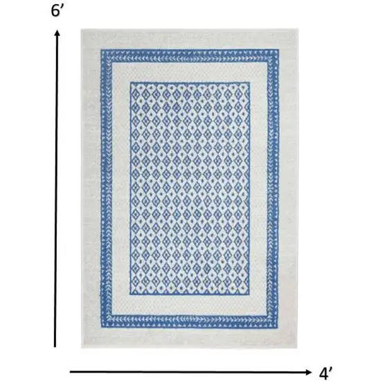 Ivory and Blue Geometric Area Rug Photo 1