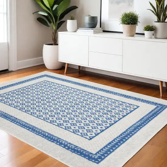Ivory And Blue Geometric Area Rug Photo 2