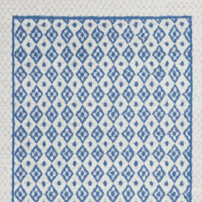 Ivory And Blue Geometric Area Rug Photo 1
