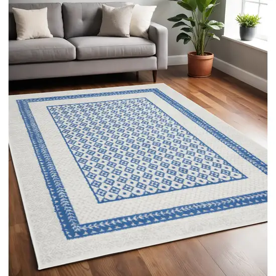 Ivory And Blue Geometric Area Rug Photo 2
