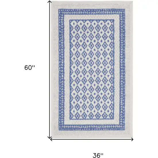 Ivory and Blue Geometric Distressed Area Rug Photo 3