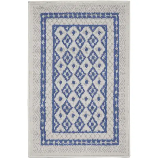Ivory and Blue Geometric Distressed Area Rug Photo 1