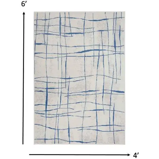 Ivory and Blue Irregular Grids Area Rug Photo 1