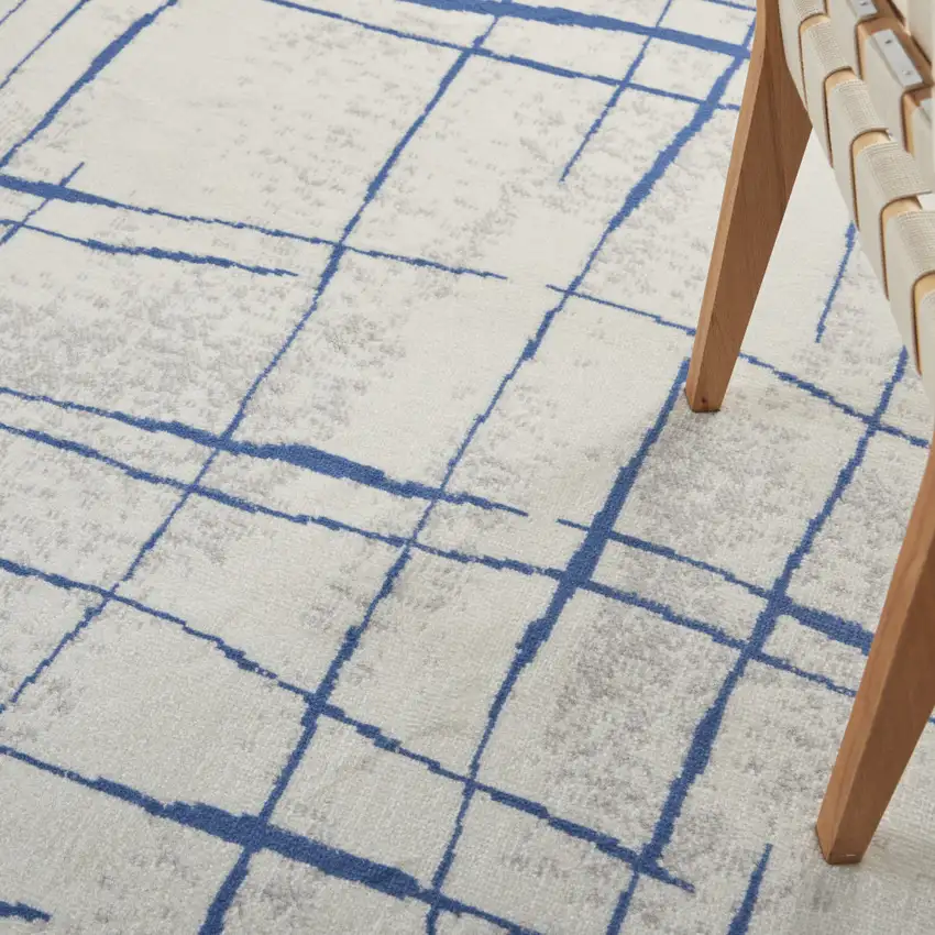 Ivory And Blue Geometric Distressed Area Rug Photo 9