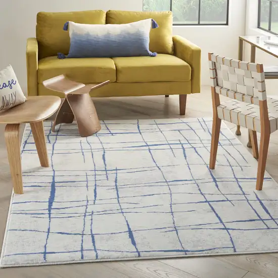 Ivory And Blue Geometric Distressed Area Rug Photo 4