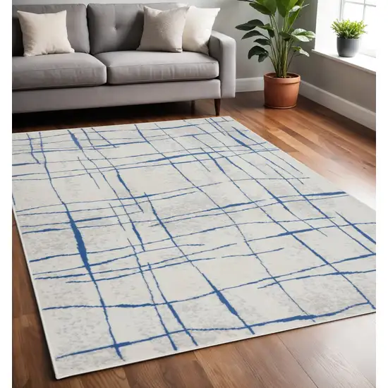 Ivory And Blue Geometric Distressed Area Rug Photo 2