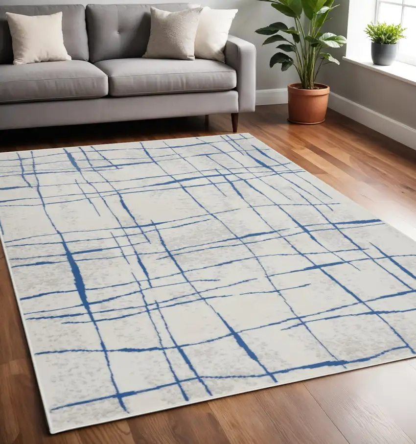 Ivory And Blue Geometric Distressed Area Rug Photo 2