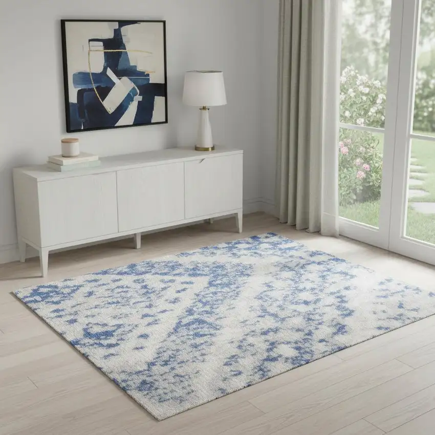 Ivory And Blue Geometric Area Rug Photo 1