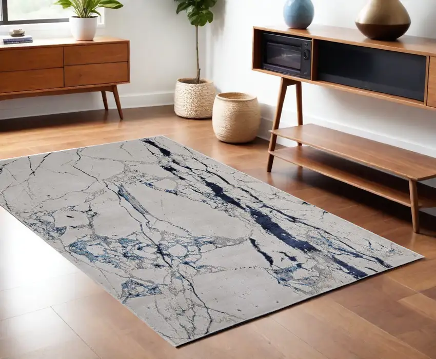 Ivory and Blue Marble Power Loom Distressed Area Rug Photo 1
