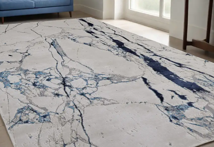 Ivory and Blue Marble Power Loom Distressed Area Rug Photo 1