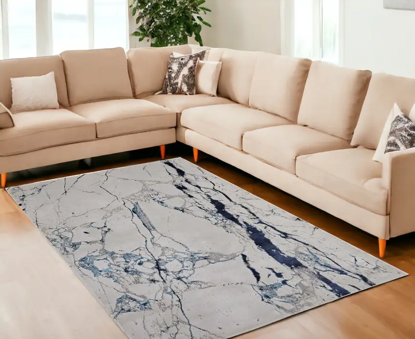 Ivory and Blue Marble Power Loom Distressed Area Rug Photo 1