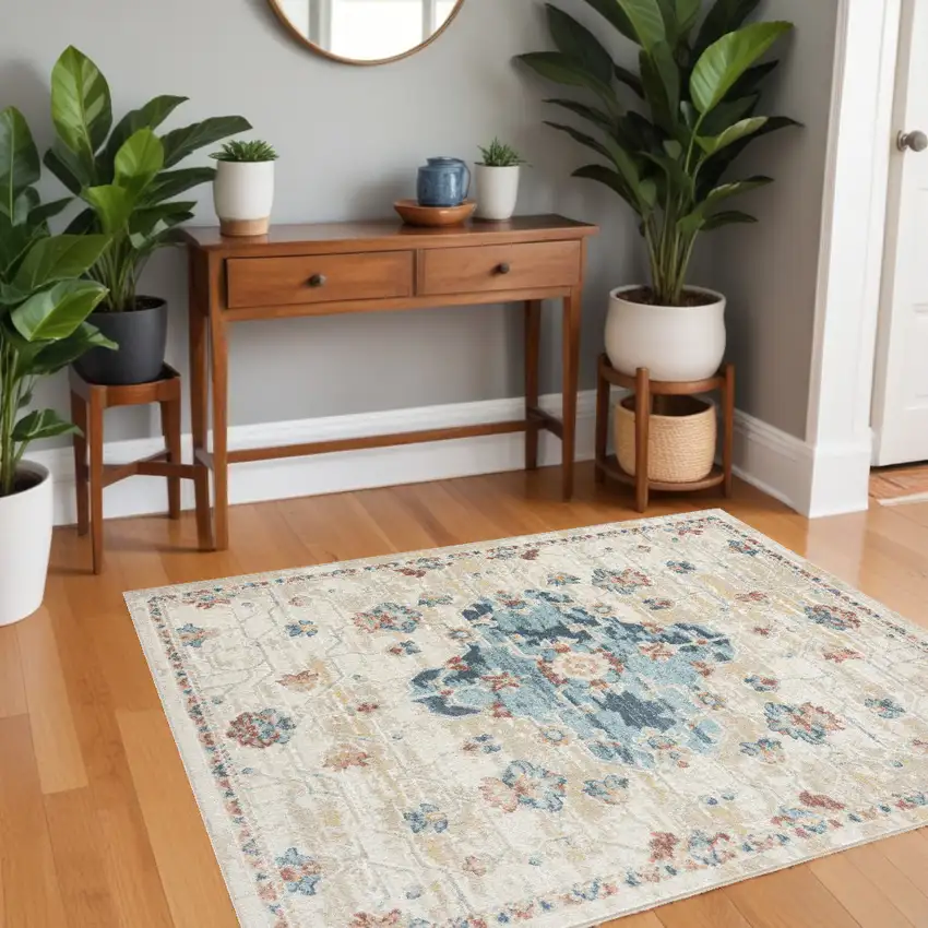 Ivory and Blue Medallion Power Loom Area Rug Photo 1