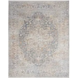 Photo of Ivory and Blue Oriental Power Loom Distressed Area Rug With Fringe