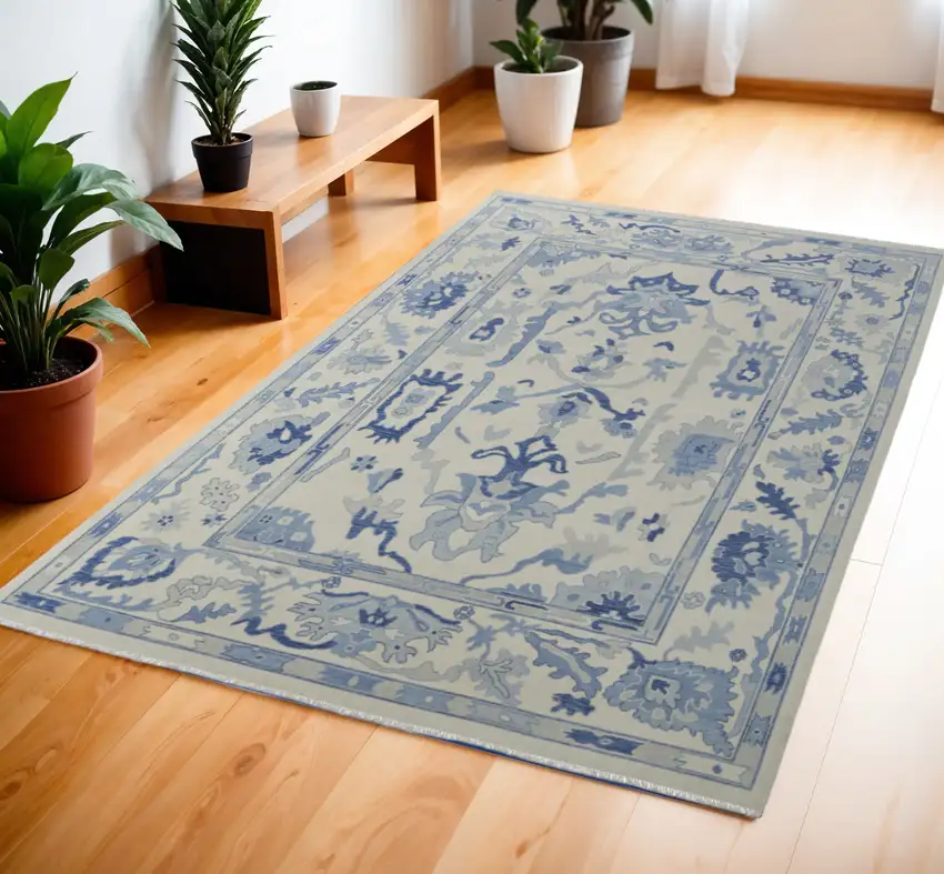 Ivory and Blue Wool Floral Hand Knotted Area Rug With Fringe Photo 1