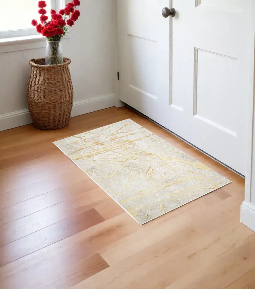 Ivory and Gold Abstract Area Rug Photo 2