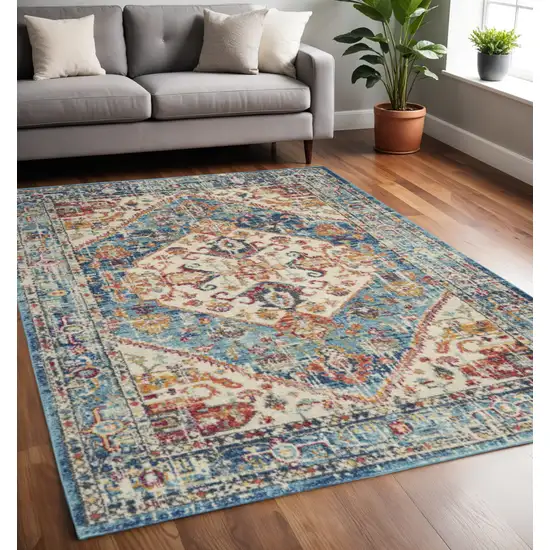 Ivory And Blue Oriental Distressed Area Rug Photo 1