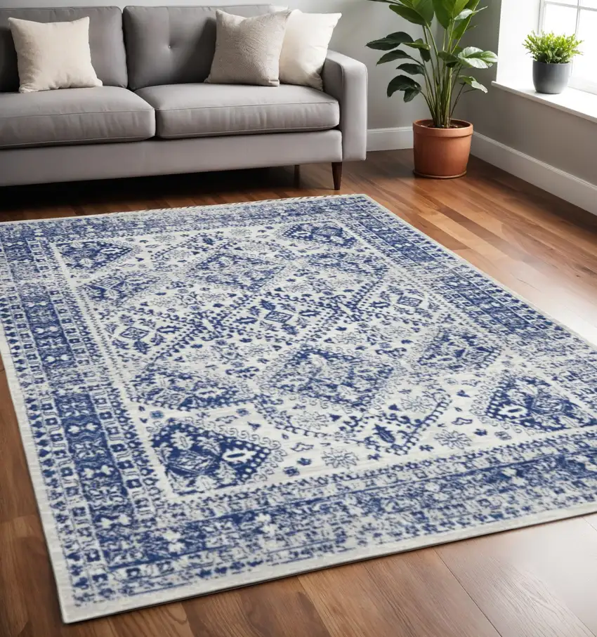Ivory And Blue Geometric Distressed Area Rug Photo 1