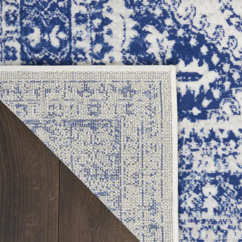 Ivory And Blue Geometric Distressed Area Rug Photo 9