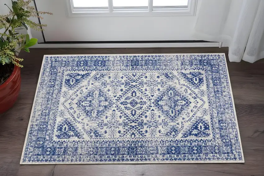 Ivory And Blue Geometric Distressed Area Rug Photo 2
