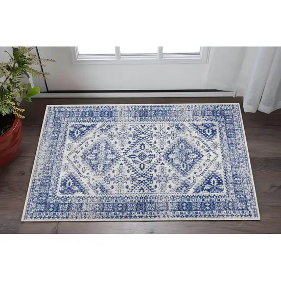Ivory And Blue Geometric Distressed Area Rug Photo 2