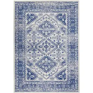 Photo of Ivory and Navy Geometric Area Rug