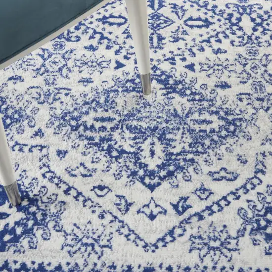 Ivory And Blue Geometric Distressed Area Rug Photo 9