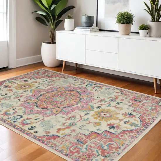 Pink And Ivory Southwestern Distressed Area Rug Photo 1