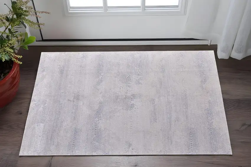 Ivory and Silver Abstract Power Loom Worn Faded Area Rug Photo 1