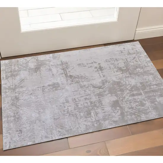 Ivory and Silver Abstract Power Loom Worn Faded Area Rug Photo 1