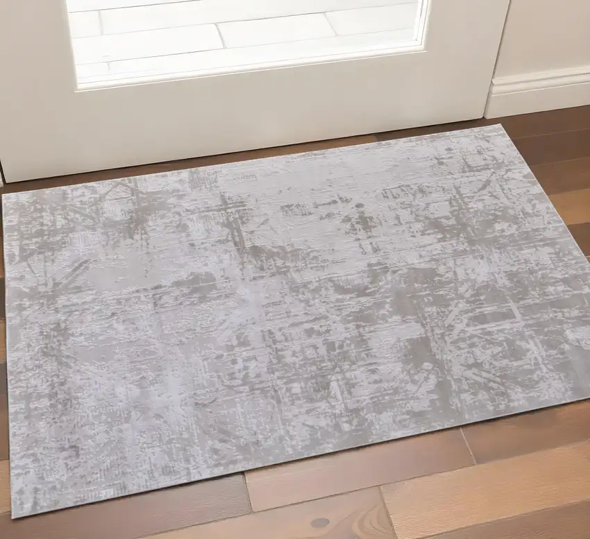 Ivory and Silver Abstract Power Loom Worn Faded Area Rug Photo 1