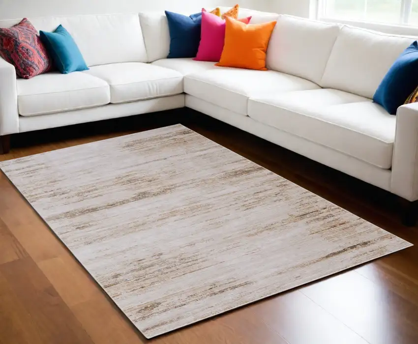 Ivory and Tan Abstract Power Loom Worn Faded Area Rug Photo 1
