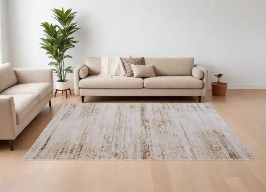 Ivory and Tan Abstract Power Loom Worn Faded Area Rug Photo 1