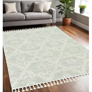 Photo of Ivory or Beige Geometric Diamond Indoor Area Rug with Fringe