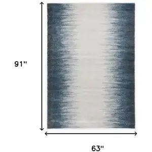Photo of Ivory or Blue Gradient Bordered Indoor Area Rug
