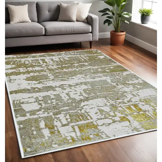 Ivory And Gold Abstract Area Rug Photo 1