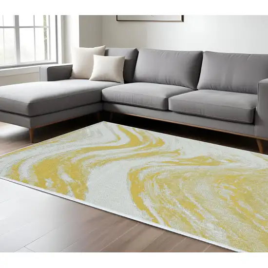 Ivory And Gold Abstract Area Rug Photo 1