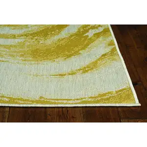 Photo of Ivory or Gold Polypropylene Area Rug