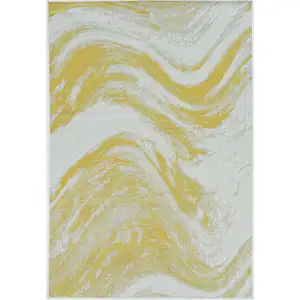 Photo of Ivory or Gold Polypropylene Area Rug