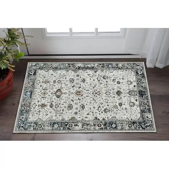 Gray And Ivory Floral Medallion Distressed Area Rug Photo 1