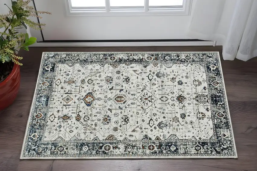Gray And Ivory Floral Medallion Distressed Area Rug Photo 1
